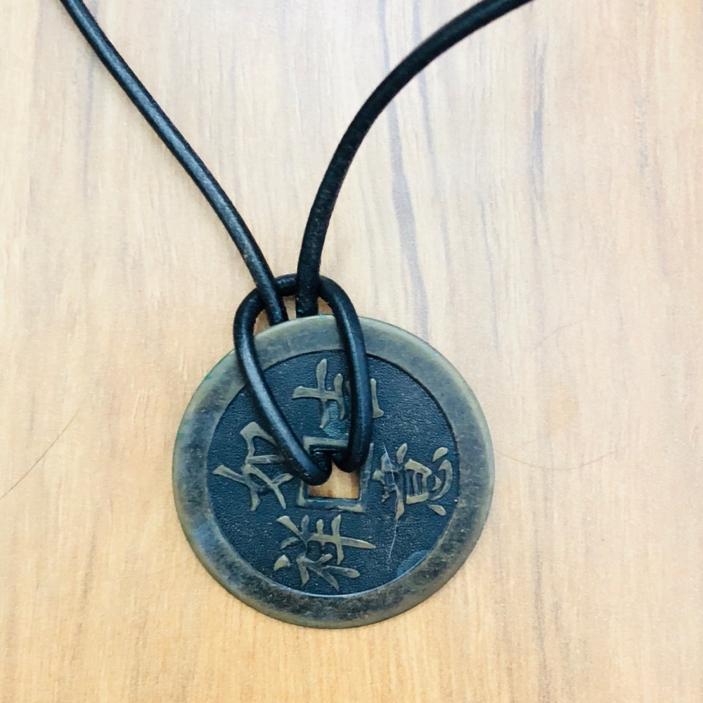 Carolee double faced medallion leather necklace.